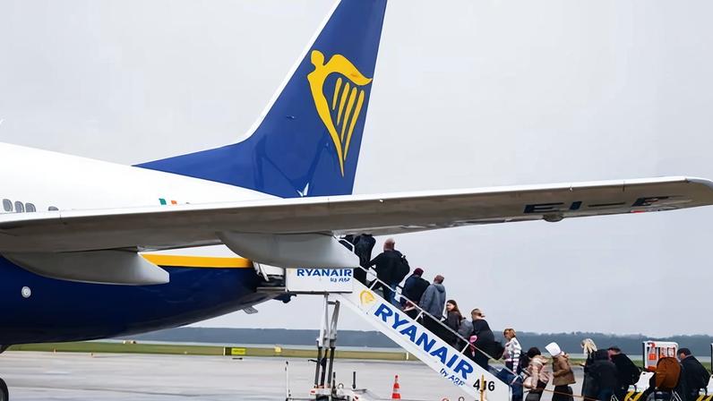 Passengers boarding a Ryanair plane. Emissions per passenger are typically lowest on short-haul, fuel-efficient modern fleets with large numbers packed into economy seats.