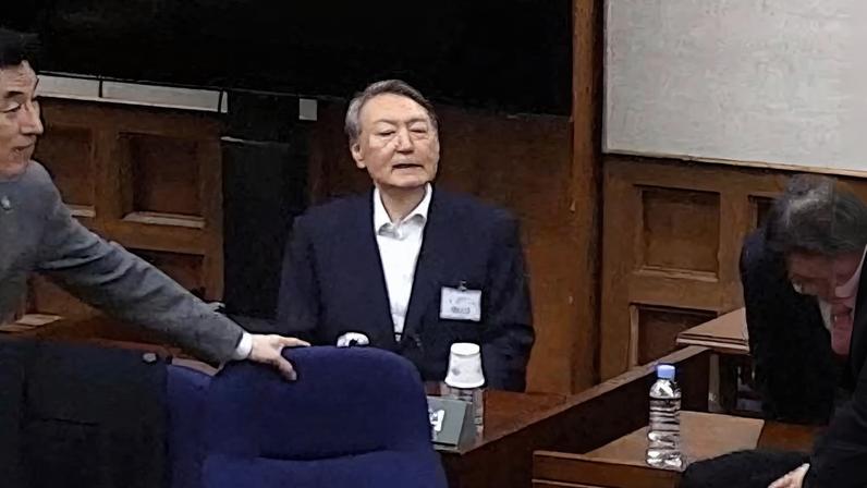 Former South Korean President Yoon Suk Yeol at the Seoul Central District Court, for his sentencing trial in his insurrection case, stemming from his short-lived declaration of martial law in December 2024, in Seoul, South Korea, in this screen grab provided by the Seoul Central District Court, February 19, 2026. Yonhap via REUTERS