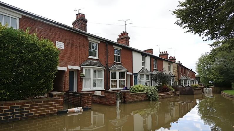A flooded residential street in Hitchin, England in September 2024.