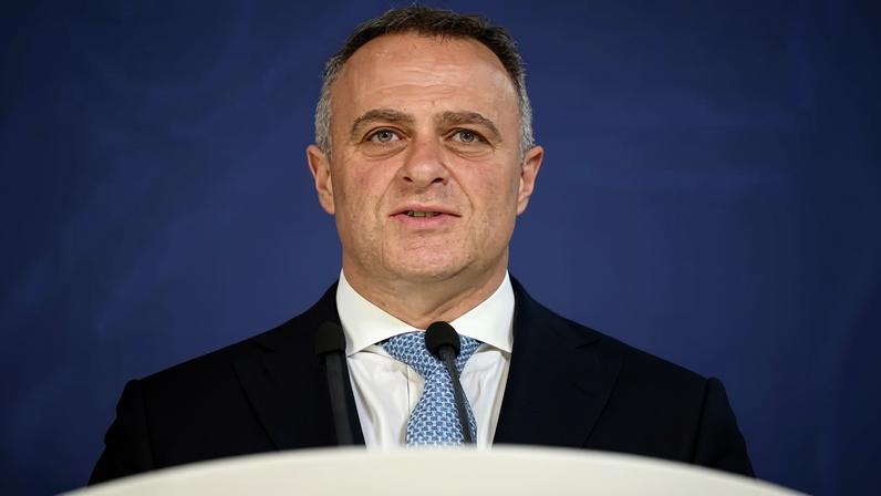 The new shadow treasurer, Tim Wilson, behind a podium