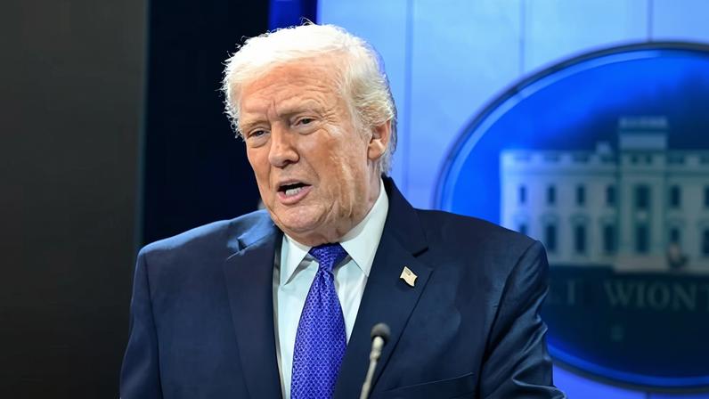 US president Donald Trump speaking from a lectern