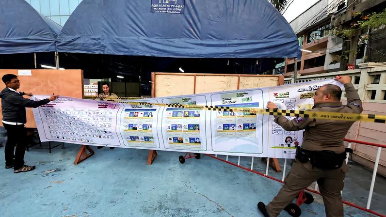 Election workers place information ahead of the general election at a polling station in Bangkok, Thailand, February 8, 2026. REUTERS/Maxim Shemetov