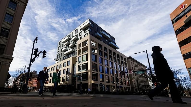 Pedestrians walk by the building that housed the Palantir headquarters in Denver, Colorado, on 31 January 2024.