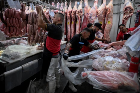 Workers arrange meat at the H&H meat-packing plant in Buenos Aires on 5 December 2025.