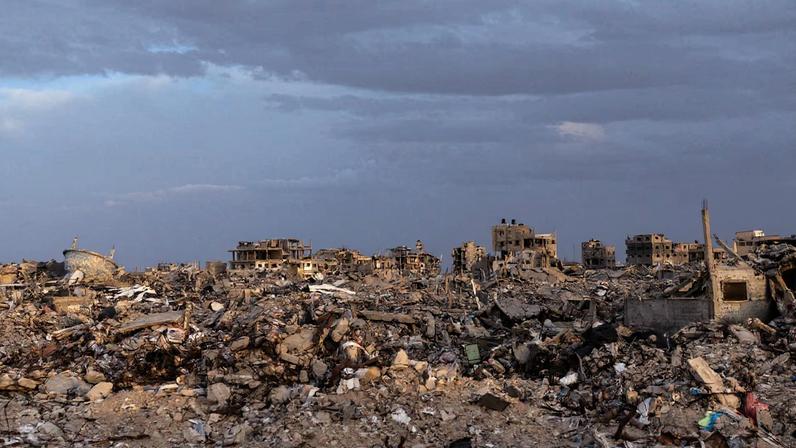 Buildings lie in ruins amidst the rubble in Rafah, in the southern Gaza Strip, on December 8, 2025.