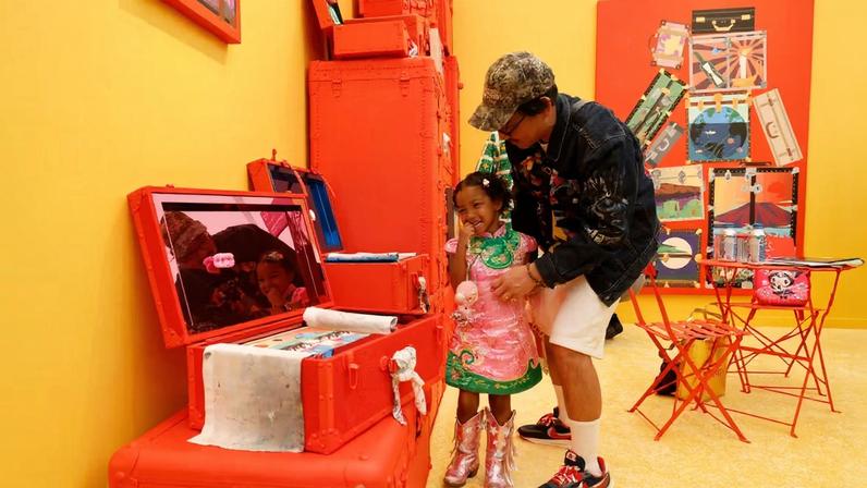 Generational: Greg Ito shows work from his installation at Superposition Gallery’s stand to his daughter