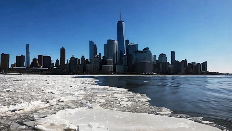 Ice floats cover part of the Hudson River along the Manhattan shoreline as New York City experiences frigid temperatures following a winter storm last weekend on 30 January.