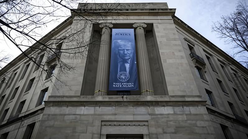 The US justice department, with its new banner of Trump hung on the building’s exterior.