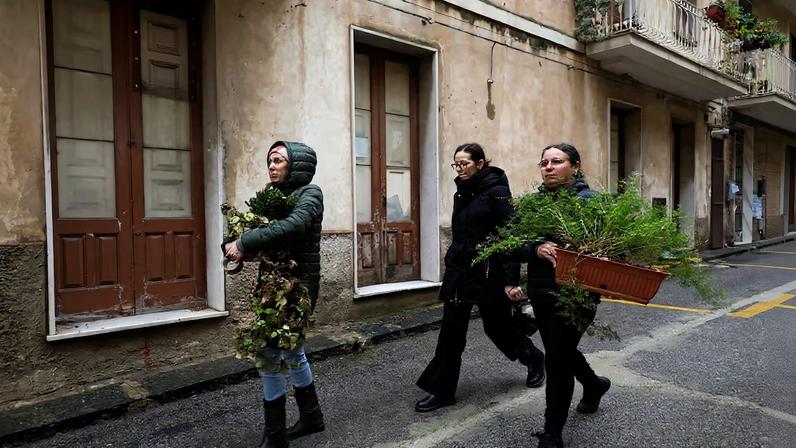 Residents scramble to remove belongings from homes in high-risk areas following a landslide in Niscemi
