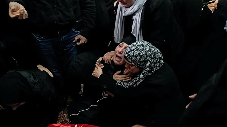 Family members with the body of Nasrallah Abu Siyam, who was shot dead on Wednesday.