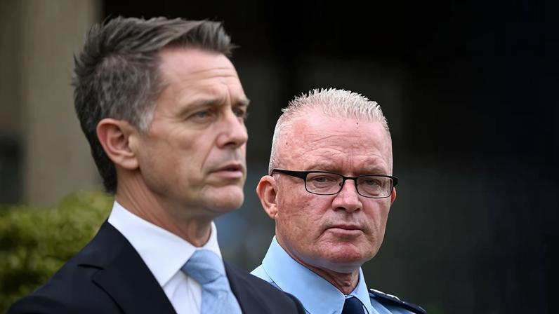 NSW police commissioner Mal Lanyon (right), who has been urged to apologise for police conduct towards the Muslim community during the Sydney protests, during a press conference with premier Chris Minns.