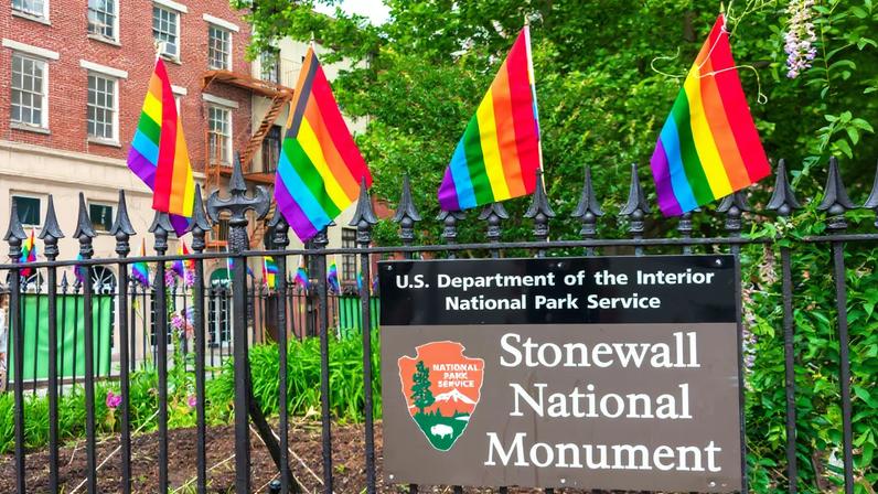Rainbow flags at Christopher Park, part of the Stonewall National Monument. A larger LGBTQ+ flag was removed by the Trump administration this week, sparking protests