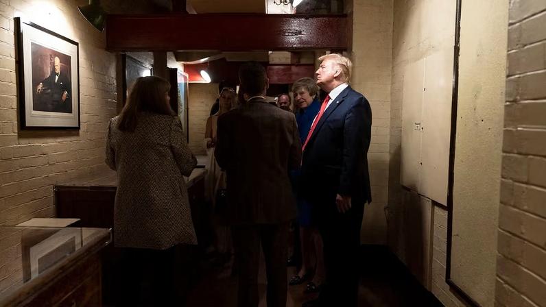 The US president, Donald Trump (at right), admires a portrait of Winston Churchill during a tour of the Churchill War Rooms in 2019 with then-British prime minister Theresa May