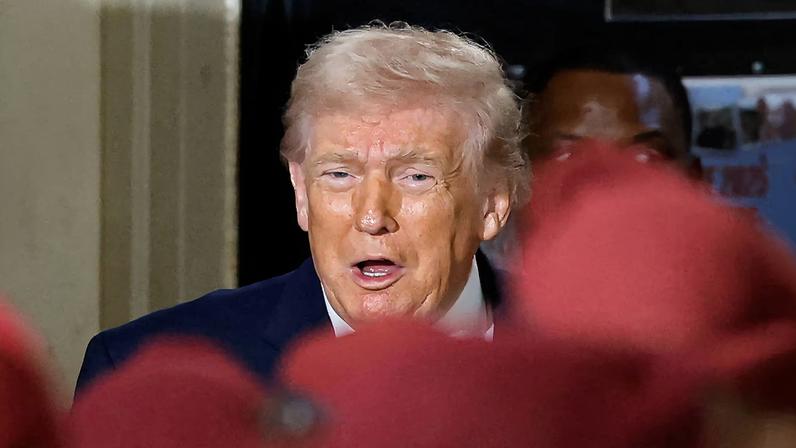 U.S. President Donald Trump reacts during a visit at Fort Bragg, North Carolina