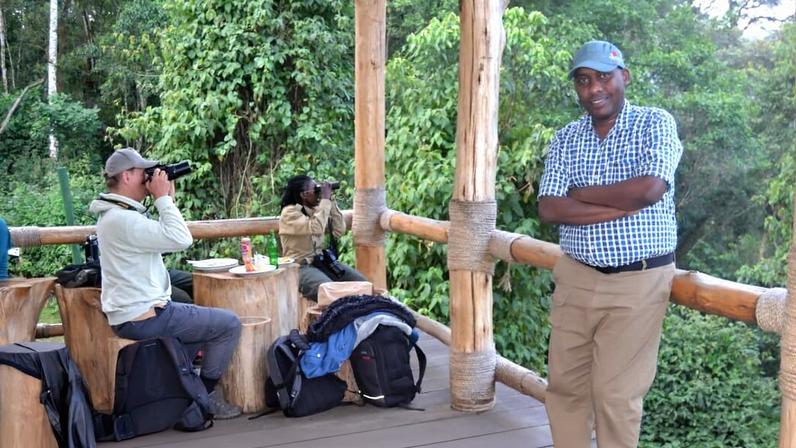 Twahirwa posing at Kuwinka, the main entrance for visitors at Nyungwe rainforest in southwestern Rwanda for field coverage. Image courtesy of Viateur Nzeyimana.
