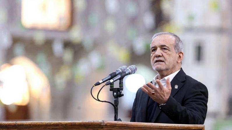Iranian President Masoud Pezeshkian speaks during a visit to the shrine of the leader of Iran's 1979 Islamic Revolution, Ayatollah Ruhollah Khomeini, in southern Tehran