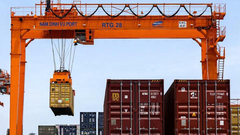 A container is loaded onto a cargo ship while docked at Hai Phong port in Hai Phong, Vietnam, April 16, 2025. REUTERS/Athit Perawongmetha