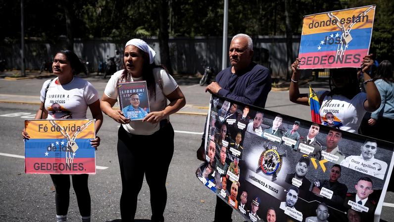 People rally at the entrance of the Central University of Venezuela calling for the release of prisoners after the announcement of an amnesty law, in Caracas, Venezuela, February 3, 2026.