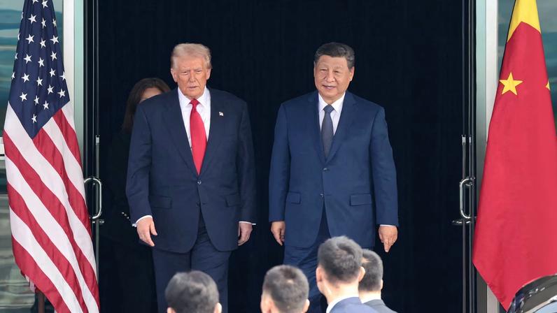 U.S. President Donald Trump and Chinese President Xi Jinping walk as they leave after a bilateral meeting at Gimhae International Airport, on the sidelines of the Asia-Pacific Economic...