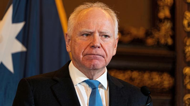 FILE PHOTO: Minnesota Governor Tim Walz speaks to reporters after he announced that he would not seek reelection