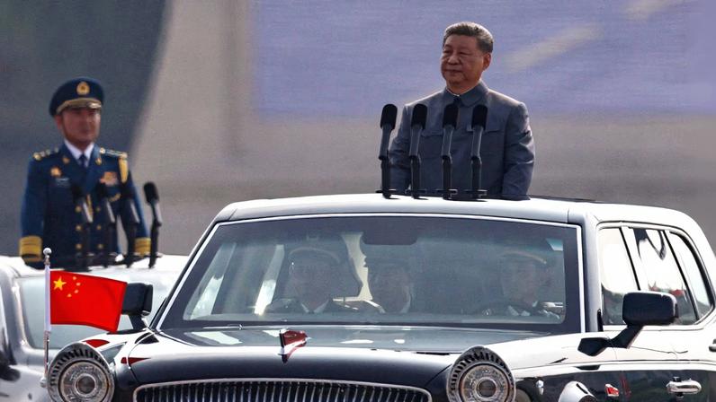 Chinese President Xi Jinping stands in a car to review the troops during a military parade to mark the 80th anniversary of the end of World War Two, in Beijing, China, September 3, 2025.