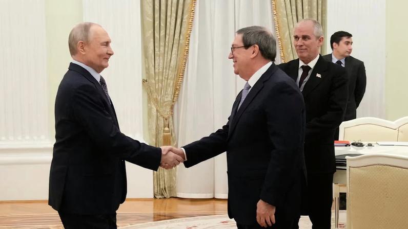 Russian President Vladimir Putin and Cuban Foreign Minister Bruno Rodriguez Parrilla attend a meeting at the Senate Palace of the Kremlin in Moscow