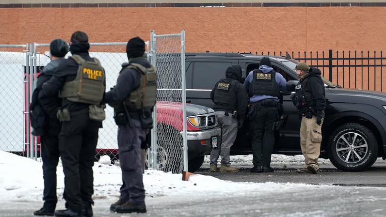 Members of U.S. Immigration and Customs Enforcement (ICE) conduct raids in Minneapolis