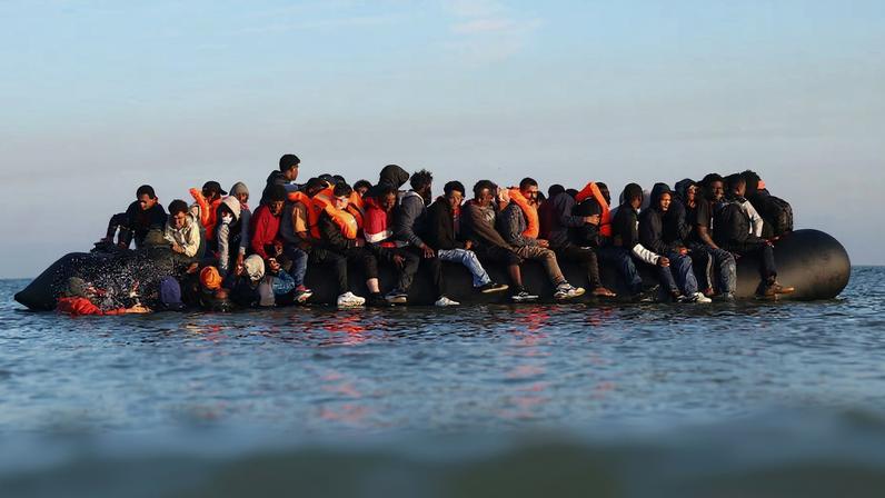 A group of migrants on an inflatable dinghy leave the beach of Petit-Fort-Philippe in northern France in an attempt to cross the English Channel to reach Britain, in Gravelines, near Calais, France, September 27, 2025. REUTERS/Abdul Saboor/File Photo