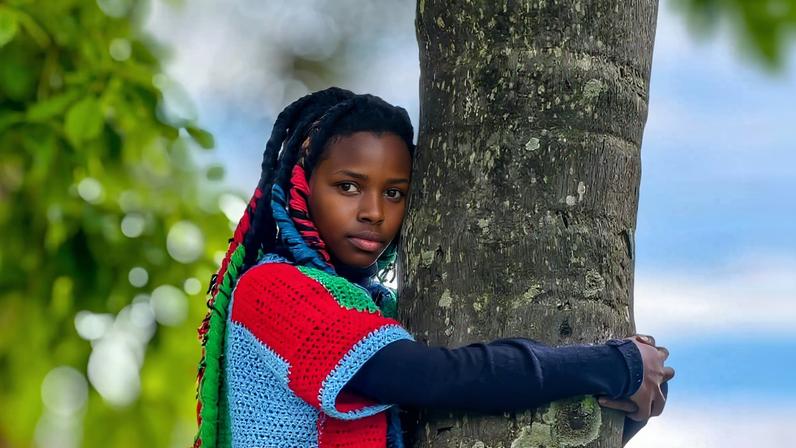 Truphena Muthoni hugging a tree for 72 consecutive hours. Image courtesy of Nyeri Governor Mutahi Kahiga