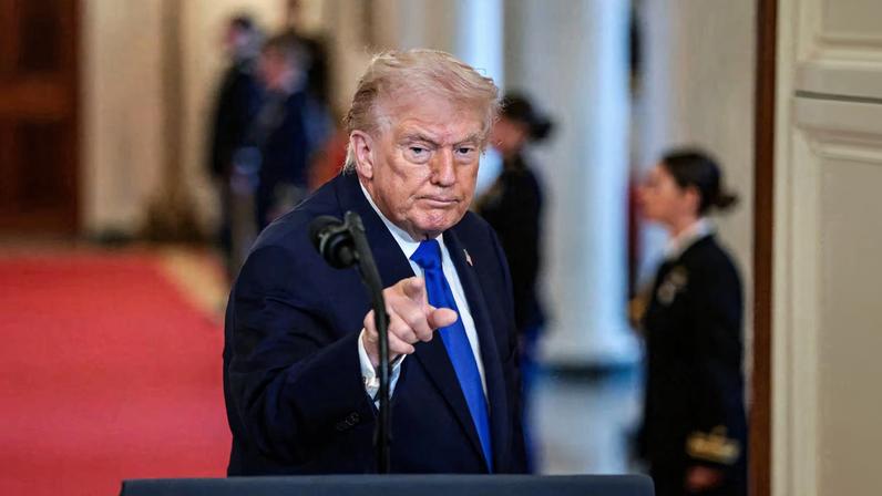U.S. President Donald Trump gestures at the end of an event to honor "Angel Families" who have lost family members to crimes committed by people in the country illegally, at the White House in Washington, D.C., U.S., February 23, 2026.