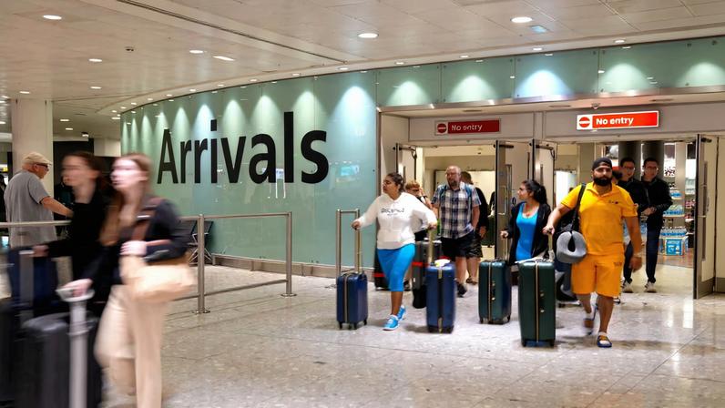 People arrive to London Heathrow Terminal 3 in London, Britain, August 22, 2023. REUTERS/Maja Smiejkowska