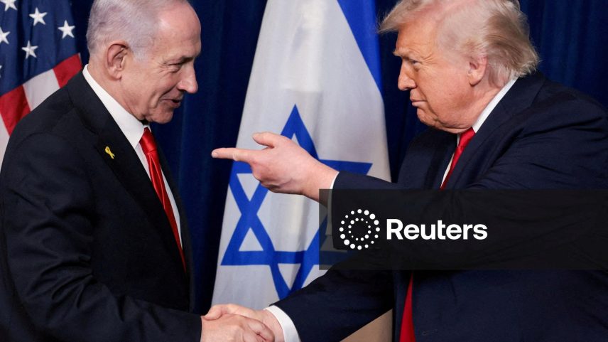 U.S. President Donald Trump points his finger towards Israeli Prime Minister Benjamin Netanyahu as they shake hands during a press conference after meeting at Trump’s Mar-a-Lago club in Palm Beach
