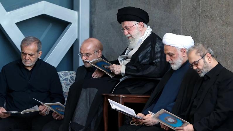 Iranian Supreme leader Ali Khamenei is alongside Iran's President Masoud Pezeshkian, Parliament Speaker Mohammad Bagher Ghalibaf, Judiciary Chief Mohsen Ejeie, and Hezbollah representative in Iran Abdallah Safieddine reading the Koran during the Friday prayer ceremony on October 04, 2024 in Tehran.