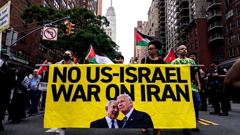 People march during a rally calling for the Trump administration not to go to war with Iran, in New York City.