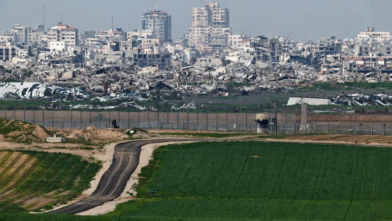 A field on the Israeli side of the Israel-Gaza border in southern Israel, January 21, 2026. Destruction in Gaza can be seen in the background.