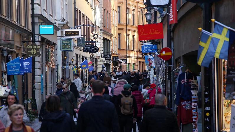 Pedestrians walk along a street in the Old Town of Stockholm, Sweden, October 17, 2024. REUTERS/ Tom Little/File Photo