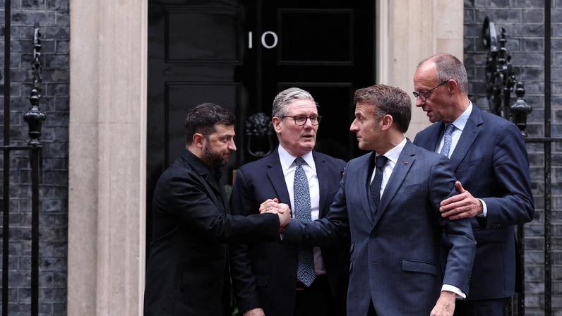 British Prime Minister Keir Starmer, Ukrainian President Volodymyr Zelenskiy, French President Emmanuel Macron, and German Chancellor Friedrich Merz chat outside 10 Downing Street following a meeting, in London, Britain, December 8, 2025. ADRIAN DENNIS/Pool via REUTERS