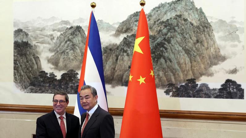 Chinese Foreign Minister Wang Yi and Cuban Foreign Minister Bruno Rodriguez Parrilla shake hands before their meeting at the Diaoyutai State Guesthouse in Beijing, China May 12, 2025.