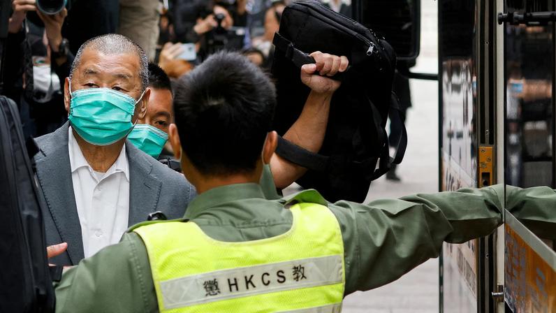 Media mogul Jimmy Lai, founder of Apple Daily, leaves the Court of Final Appeal by prison van in Hong Kong