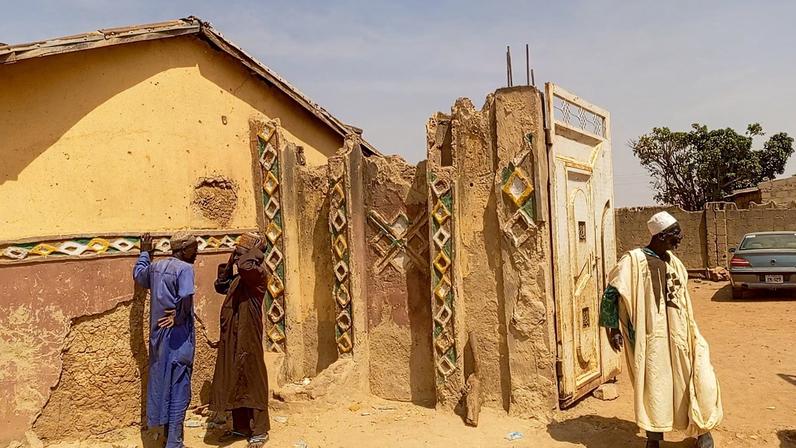 Members of the local community gather outside the residence of the Emir of Tafoki to offer condolences following a deadly raid carried out by armed gunmen from a local gang, in Doma, Katsina State, Nigeria, February 4, 2026. Picture taken with a phone.