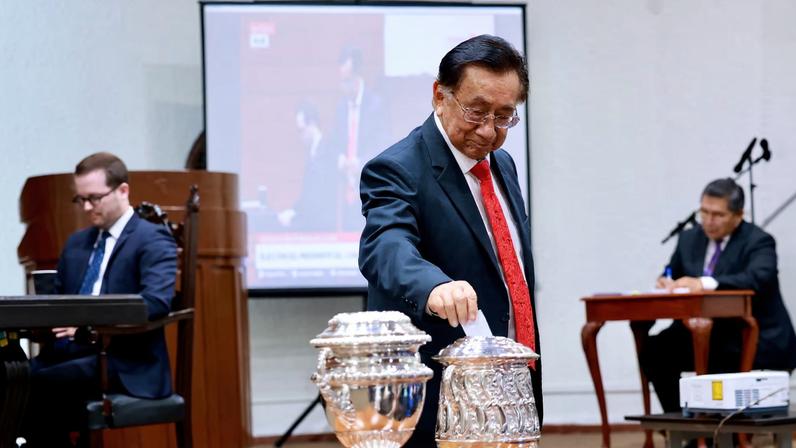 Jose Maria Balcazar, a member of Peru's Congress, casts his vote as Congress holds a session to elect a new president following Jose Jeri's ousting over a scandal involving undisclosed meetings with a Chinese businessman, in Lima, Peru February 18, 2026.