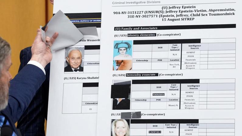 U.S. Representative Thomas Massie (R-KY) lifts a piece of paper on a board displaying a Federal Bureau of Investigation (FBI) document, revealing an image of businessman Les Wexner, while questioning U.S. Attorney General Pam Bondi during a House Judiciary Committee hearing on oversight of the Justice Department, on Capitol Hill in Washington, D.C.