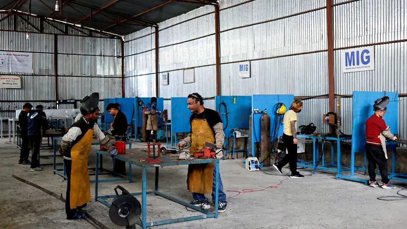 People preparing to leave the country and apply for foreign employment learn to weld at Motherland Overseas, a recruitment agency, as Nepal's biggest political parties vow to fix the outflow of workers ahead of the elections of the House of Representatives scheduled for March 5, triggered by historic youth-led protests fuelled by the lack of jobs and endemic corruption that forced an elected prime minister to resign, in Kathmandu, Nepal, February 22, 2026. REUTERS/Navesh Chitrakar