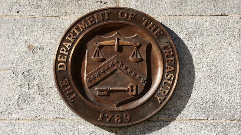 A bronze seal for the Department of the Treasury is shown at the U.S. Treasury building in Washington, U.S., January 20, 2023. REUTERS/Kevin Lamarque/File Photo