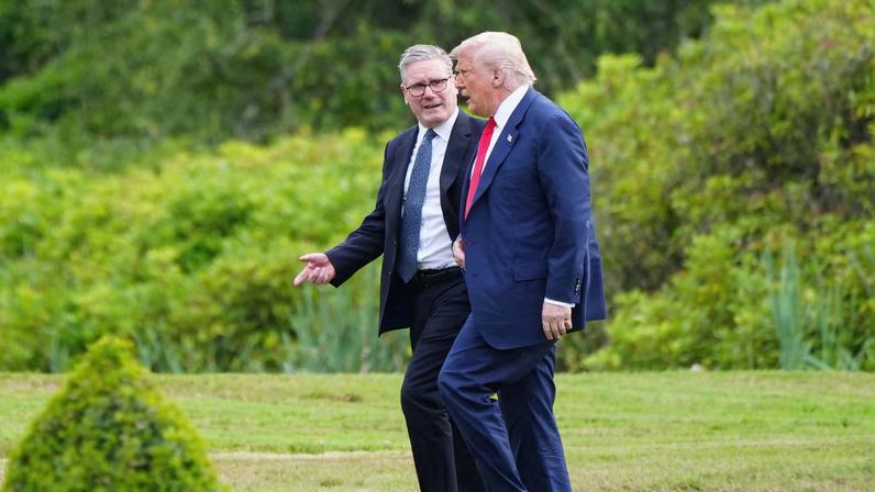 U.S. President Donald Trump walks with British Prime Minister Keir Starmer at Trump International Golf Links, in Aberdeen, Scotland, Britain, July 28, 2025. Jane Barlow/Pool via REUTERS
