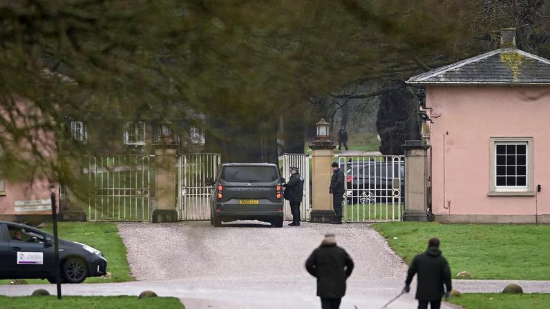 A police officer stands next to a vehicle outside Royal Lodge, a property on the estate surrounding Windsor Castle and a former residence of Andrew Mountbatten Windsor, younger brother of Britain’s King Charles, formerly known as Prince Andrew, who was arrested this morning on suspicion of misconduct in public office, BBC reports, after the U.S. Justice Department released more records tied to the late financier and convicted sex offender Jeffrey Epstein, in Windsor, Britain, February 19, 2026. REUTERS/Jaimi Joy