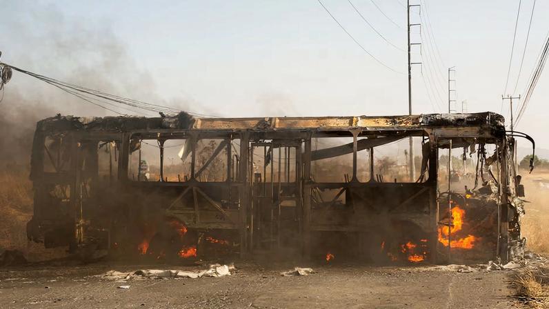 A bus used as a roadblock by organized crime burns following a federal operation in which a government source said Mexican drug lord Nemesio Oseguera, commonly known as "El Mencho," was killed, in Zapopan, Mexico, February 22, 2026.