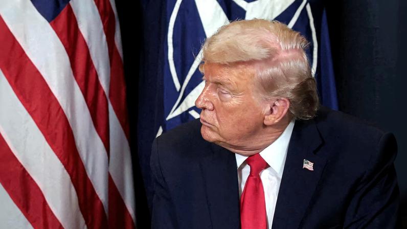 U.S. President Donald Trump listens during a bilateral meeting with NATO Secretary General Mark Rutte (not pictured) at the World Economic Forum in Davos, Switzerland, January 21, 2026.