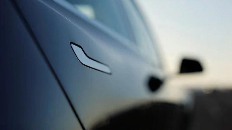 The door handle on a 2018 Tesla Model 3 electric vehicle is shown in Cardiff, California