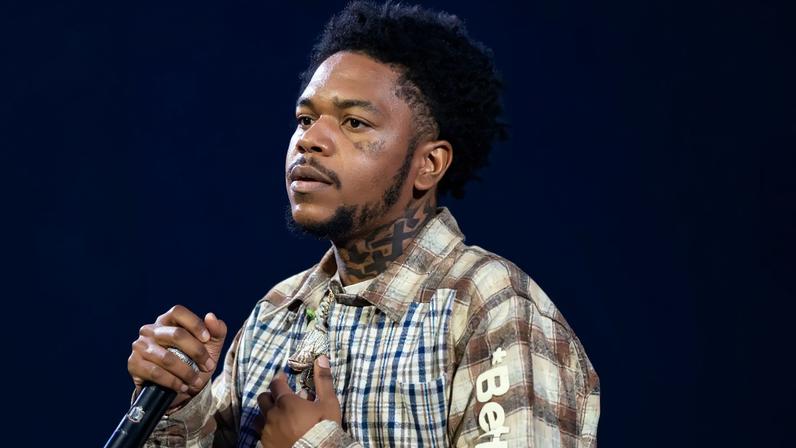 Rapper Lil Poppa, seen here onstage in Atlanta in December 2024, has died, according to TMZ.